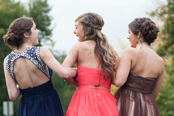 three girls in prom dresses